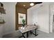 Cozy home office featuring a decorative wooden desk, shelving, and soft carpeting at 847 Emerald Grove Dr, Apopka, FL 32703