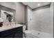 Bathroom featuring a modern vanity with double sinks, a white marble walk-in shower, and a neutral wall color at 855 Emerald Grove Dr, Apopka, FL 32703