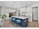 Modern kitchen features stainless steel appliances, a kitchen island, and pendant lighting at 855 Emerald Grove Dr, Apopka, FL 32703