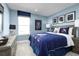 Themed bedroom featuring Star Wars decor, a comfortable bed, and a window at 1156 Ivy Manor St, Minneola, FL 34715