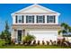 Charming two-story home with landscaped yard and a two-car garage at 1156 Ivy Manor St, Minneola, FL 34715