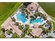 Aerial view of community pool, clubhouse, and amenities, nestled amidst lush landscaping at 3612 Northwoods Dr, Kissimmee, FL 34746