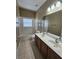 Bathroom with a double sink vanity, bath tub and shower combo, and tile flooring at 3612 Northwoods Dr, Kissimmee, FL 34746
