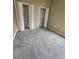Bedroom with neutral walls, carpet, and two closets with built-in shelving at 3612 Northwoods Dr, Kissimmee, FL 34746