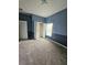 Bedroom with carpet, a closet with built in shelving and an accent wall at 3612 Northwoods Dr, Kissimmee, FL 34746