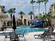 Community pool area features ample seating, waterslide, and clubhouse at 3612 Northwoods Dr, Kissimmee, FL 34746