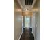 Hallway with hard wood floors and views of the bathroom and other rooms at 3612 Northwoods Dr, Kissimmee, FL 34746