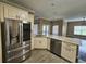 Well-lit kitchen with stainless steel appliances, granite countertops, and a modern design at 3612 Northwoods Dr, Kissimmee, FL 34746