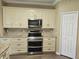This kitchen features stainless steel appliances, sleek cabinetry and ample countertop space for all your cooking needs at 3612 Northwoods Dr, Kissimmee, FL 34746