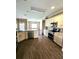 Well-lit kitchen features stainless steel appliances, granite countertops, and tile backsplash at 3612 Northwoods Dr, Kissimmee, FL 34746