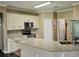 This kitchen features stainless steel appliances, granite countertops, and an island with a sink at 3612 Northwoods Dr, Kissimmee, FL 34746
