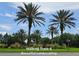 Scenic walking trails with beautiful landscaping and palm trees create a tranquil and inviting outdoor space at 3612 Northwoods Dr, Kissimmee, FL 34746