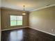 Spacious living room with hardwood floors and neutral walls provides a blank canvas at 3612 Northwoods Dr, Kissimmee, FL 34746