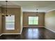 Open-concept living space featuring hardwood floors and plenty of natural light at 3612 Northwoods Dr, Kissimmee, FL 34746