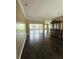 Expansive living room area with hardwood flooring and sliding doors to the outside at 3612 Northwoods Dr, Kissimmee, FL 34746
