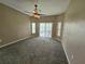 Large bedroom with carpeting, natural light and sliding glass doors to lanai at 3612 Northwoods Dr, Kissimmee, FL 34746