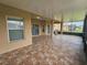 Covered patio with tile floor, perfect for outdoor relaxation and entertaining at 3612 Northwoods Dr, Kissimmee, FL 34746