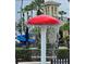 Splash pool for with a fun mushroom waterfall and a water slide at 3612 Northwoods Dr, Kissimmee, FL 34746