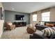 Comfortable living room featuring modern furniture, plush carpeting, and neutral tones for a relaxing ambiance at 3878 Isle Royal Pl, Apopka, FL 32712