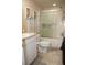 Bathroom featuring a shower, sink and toilet at 5635 Kimball Rd, Mulberry, FL 33860