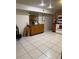 Functional kitchen area showcasing tile flooring, wooden cabinetry, countertops, and modern appliances at 5635 Kimball Rd, Mulberry, FL 33860