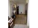 Open living space with wood look floors and decorative shelving at 5635 Kimball Rd, Mulberry, FL 33860