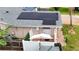 Aerial view of home featuring solar panels, umbrella patio, and charming curb appeal at 774 Hendrix Ave, Orlando, FL 32825