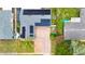 Home with solar panels and paved drive, surrounded by lush landscaping, enhancing curb appeal at 774 Hendrix Ave, Orlando, FL 32825