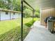 View of the backyard with manicured lawn, shed, and outdoor cooking area with a covered patio at 774 Hendrix Ave, Orlando, FL 32825