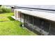 This backyard has a covered patio and solar panels at 774 Hendrix Ave, Orlando, FL 32825