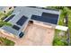 Aerial view showcases solar panels, brick-paved patio, and mature landscaping at 774 Hendrix Ave, Orlando, FL 32825