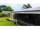 This backyard has a covered patio and solar panels at 774 Hendrix Ave, Orlando, FL 32825