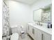 Bathroom showcasing vanity with modern fixtures, and a shower with marble curtain at 774 Hendrix Ave, Orlando, FL 32825