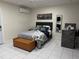 Bedroom featuring grey tile floors, black headboard and leather bench at 774 Hendrix Ave, Orlando, FL 32825