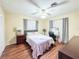 Bedroom with wood floors features a ceiling fan, and neutral walls at 774 Hendrix Ave, Orlando, FL 32825