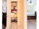 Linen closet filled with linens, shoes and storage containers at 774 Hendrix Ave, Orlando, FL 32825