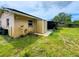 Exterior view of the home with shed, showing the backyard area and mature landscaping at 774 Hendrix Ave, Orlando, FL 32825
