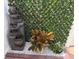 Outdoor space featuring a stone water fountain with decorative plants at 774 Hendrix Ave, Orlando, FL 32825