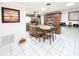 Open kitchen with a center island, stainless steel appliances, and stylish tile flooring at 774 Hendrix Ave, Orlando, FL 32825