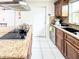 Kitchen detail showcasing the granite countertops, island cooktop and stainless steel sink at 774 Hendrix Ave, Orlando, FL 32825