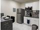 Kitchenette with stainless steel appliances and a two-person dining table at 774 Hendrix Ave, Orlando, FL 32825