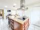 Spacious kitchen featuring an island cooktop, custom cabinetry, and modern appliances at 774 Hendrix Ave, Orlando, FL 32825
