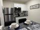 Kitchenette with stainless steel appliances and granite counter tops at 774 Hendrix Ave, Orlando, FL 32825