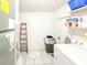 Laundry room with tile floor and a washing machine at 774 Hendrix Ave, Orlando, FL 32825