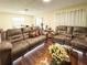 Inviting living area with hardwood floors, dual sofas, and large windows for natural lighting at 774 Hendrix Ave, Orlando, FL 32825
