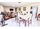 Open living space with tile and hardwood floors and a dining area adjacent to the living room at 774 Hendrix Ave, Orlando, FL 32825