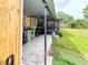 Shot of an outdoor kitchen and screened in patio in backyard at 774 Hendrix Ave, Orlando, FL 32825