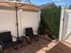 Cozy patio area with a brick floor, chairs, table and modern fountain at 774 Hendrix Ave, Orlando, FL 32825