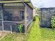 This screened porch offers a nice view of the outdoors with ample space for seating at 774 Hendrix Ave, Orlando, FL 32825