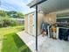 Backyard shed for storage, adjacent to an outdoor cooking area with grill under a covered patio at 774 Hendrix Ave, Orlando, FL 32825